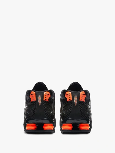 Shop Nike Black And Orange Shox Enigma Sneakers