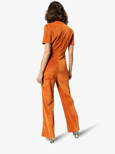 Shop Staud Zipped Velvet Jumpsuit In Orange