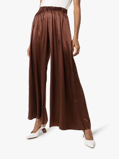 Shop Deitas Pleated Silk Palazzo Trousers In Brown