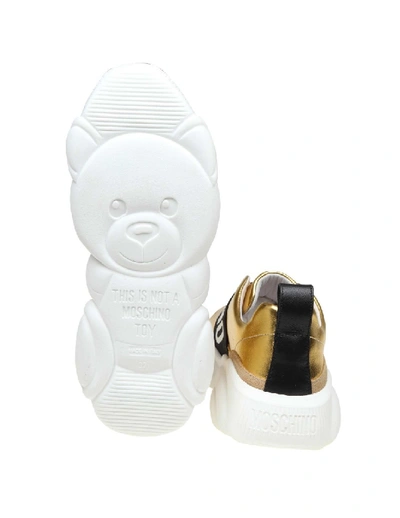 Shop Moschino Slip On Teddy Run In Gold Laminated Leather In White