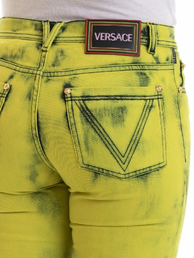 Shop Versace Colored Jeans In Gold