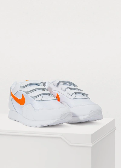 Shop Nike Outburst V Sneakers In White