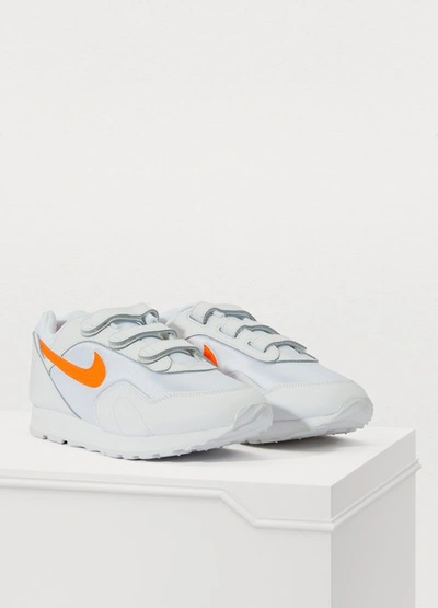 Shop Nike Outburst V Sneakers In White