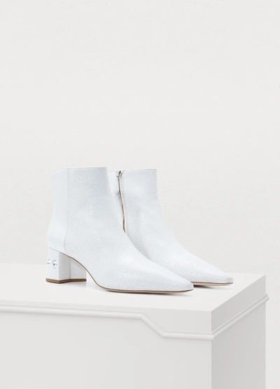 Shop Miu Miu Embossed Leather Ankle Boots In Bianco