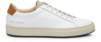 Shop Common Projects Achilles Retro Trainers In White / Tan