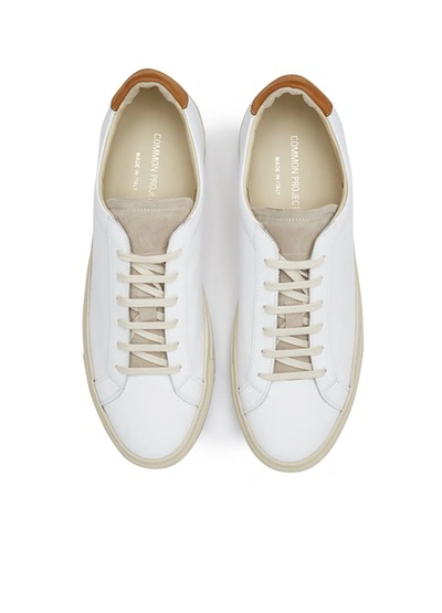 Shop Common Projects Achilles Retro Trainers In White / Tan