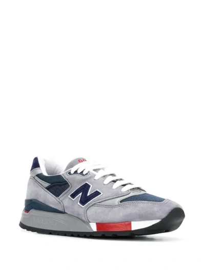 Shop New Balance Logo Embroidered Sneakers In Grey