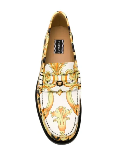 Shop Versace Hibiscus Print Leather Loafers In Black