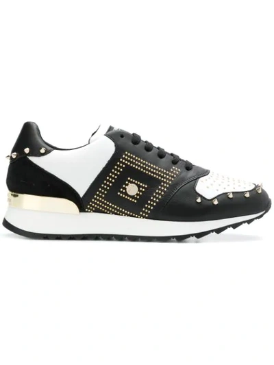 Shop Versace Studded Sneakers In Black