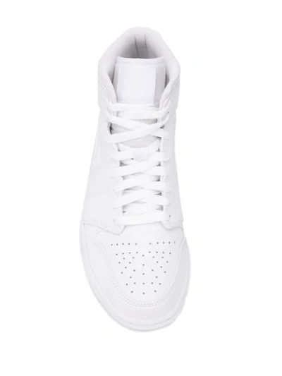 Shop Nike Air Jordan 1 Sneakers In White