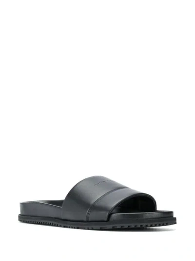 Shop Givenchy Embossed Logo Slides In Black