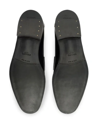 Shop Prada Logo Buckle Loafers In Black
