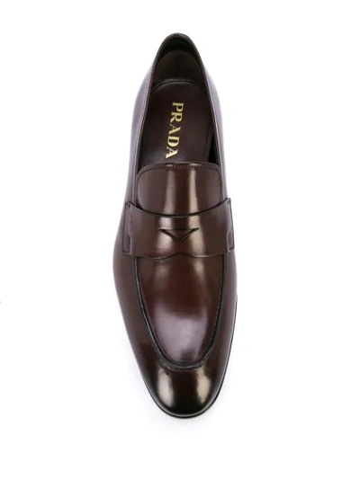 Shop Prada Logo Embossed Loafers In F0562teak