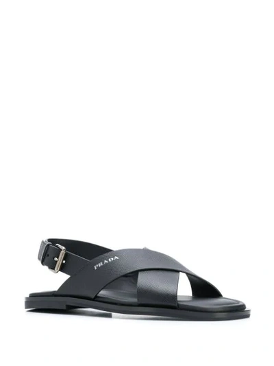 Shop Prada Side Buckle Flat Sandals In Black