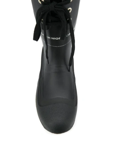Shop Undercover Lace-up Rubber Boots In Black
