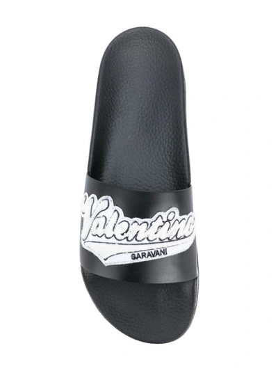 Shop Valentino Garavani Appliqué Slides In Black