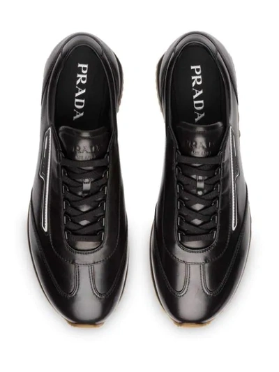 Shop Prada Low Lace-up Sneakers In Black