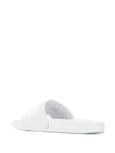 Shop Roberto Cavalli Logo Embossed Slides In White