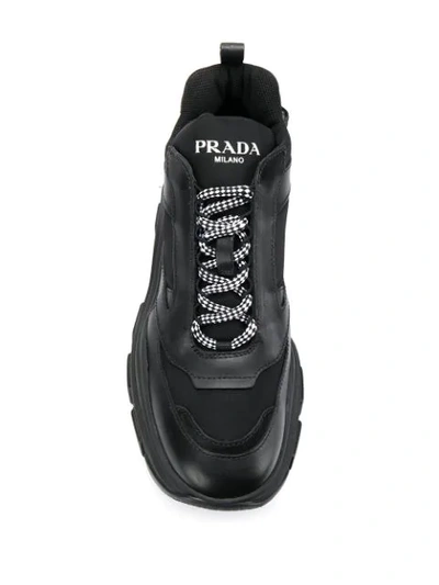 Shop Prada Pegasus Sneakers In Black