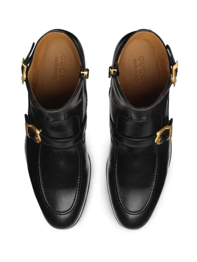 Shop Gucci Sucker Buckle Boots In Black