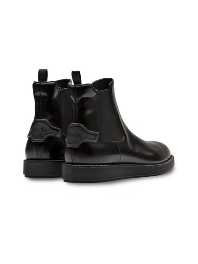 Shop Prada Slip-on Leather Booties - Black