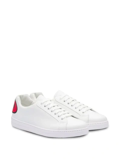 Shop Prada Leather Sneakers With Comics Patch - Weiss In White