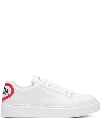 Shop Prada Graphic Print Sneakers In White