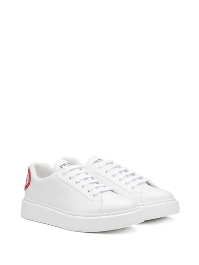 Shop Prada Graphic Print Sneakers In White