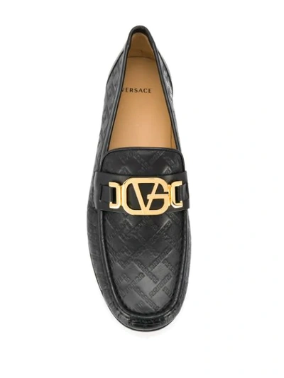 Shop Versace Greca Key Embossed Loafers In Black