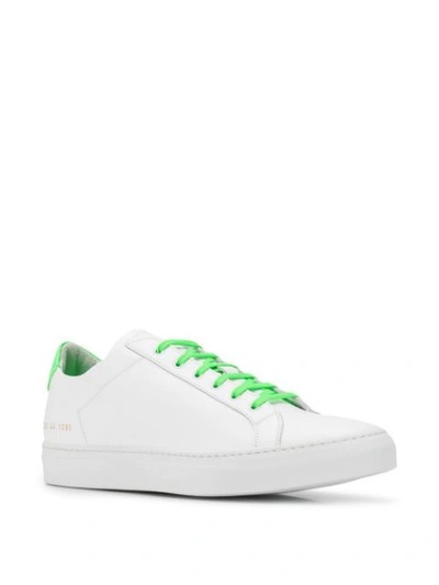 Shop Common Projects Fluorescent Achilles Low Sneakers In White