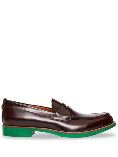 Shop Burberry D-ring Detail Contrast Sole Leather Loafers In Red