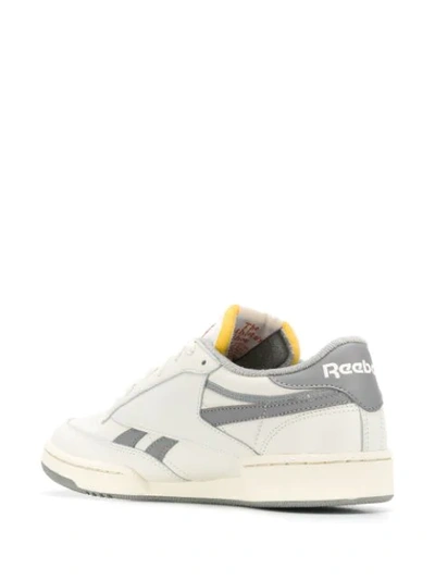 Shop Reebok Revenge Plus Sneakers In White