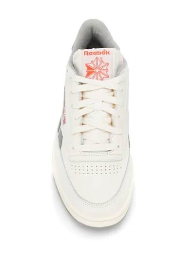 Shop Reebok Revenge Plus Sneakers In White