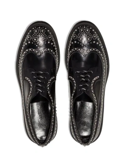 Shop Alexander Mcqueen Studded Lace-up Brogues In Black