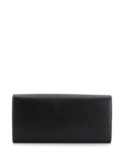 Shop Ferragamo Gancini Embossed Logo Wallet In Black