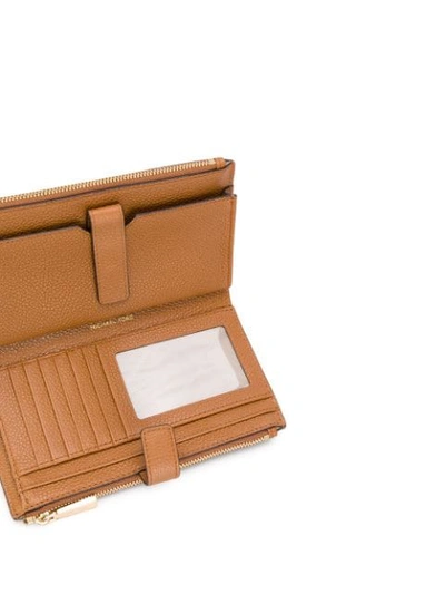 Shop Michael Michael Kors Wristlet Continental Wallet In Brown