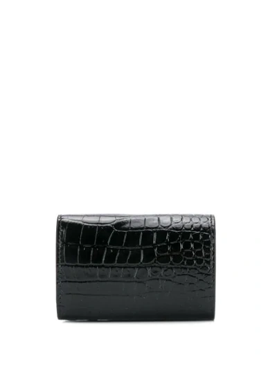 Shop Saint Laurent Crocodile-effect Bi-fold Wallet In Black