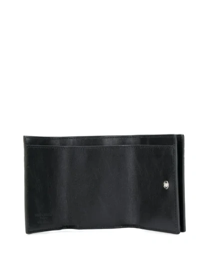 Shop Saint Laurent Crocodile-effect Bi-fold Wallet In Black