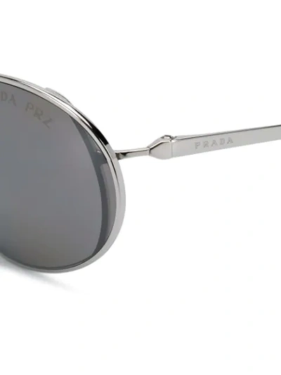 Shop Prada Oval Frame Sunglasses In Silver