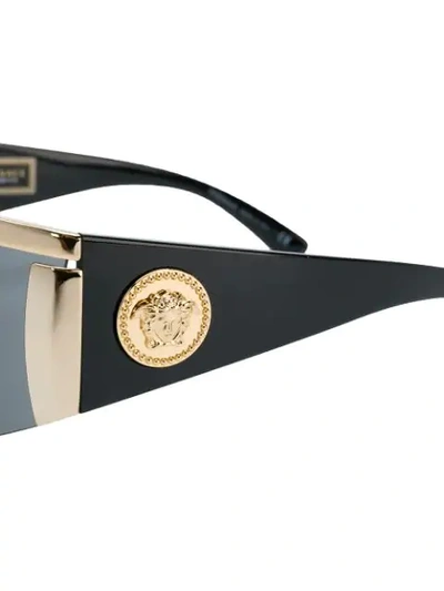 Shop Versace Tinted Visor Sunglasses In 1000/87