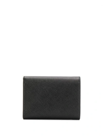 Shop Prada Saffiano Tri-fold Wallet In Black