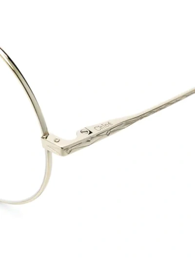 Shop Chloé Round Frame Glasses In Metallic