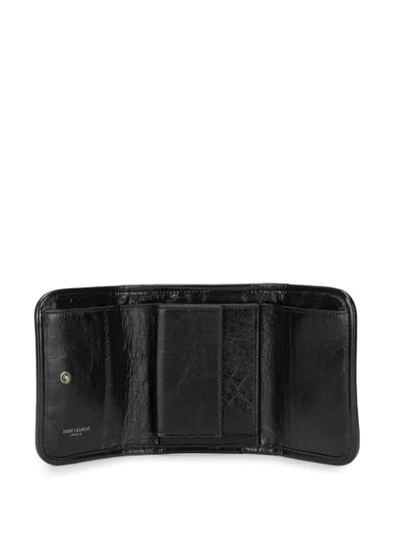 Shop Saint Laurent Niki Bi-fold Crinkled Wallet In Black