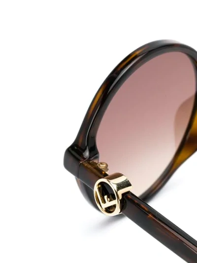 Shop Fendi Round Frame Sunglasses In Brown
