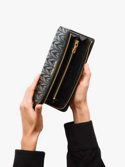 Shop Miu Miu Matelassé Zip-around Wallet In Black