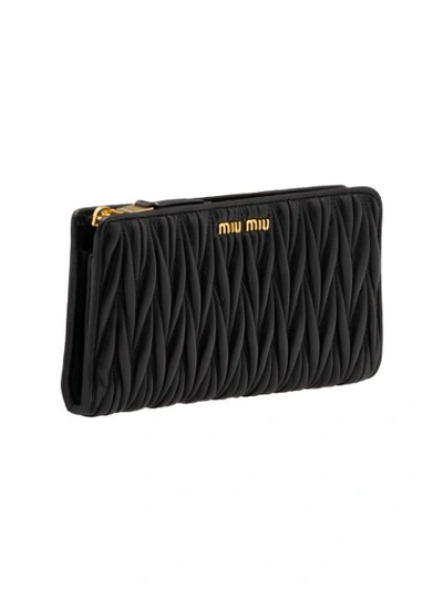 Shop Miu Miu Matelassé Zip-around Wallet In Black