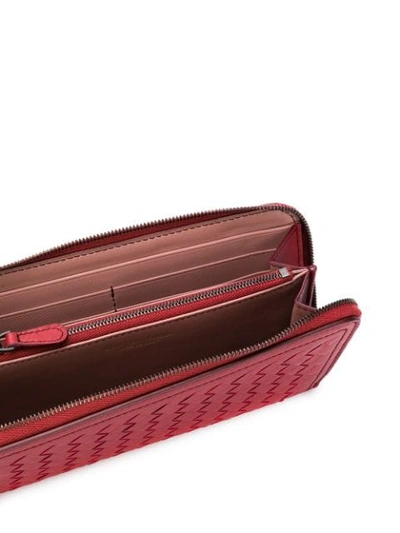 Shop Bottega Veneta Intrecciato Weave Zip-around Wallet In Red