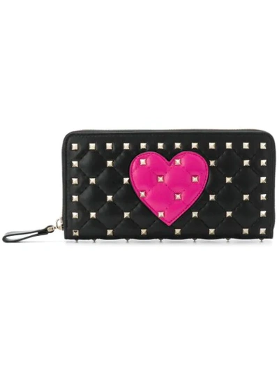 Shop Valentino Garavani Rockstud Spike Heart Zip Around Wallet - Black