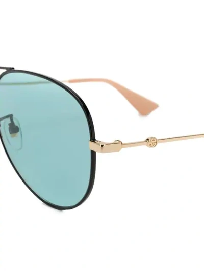 Shop Gucci Aviator Sunglasses In Gold