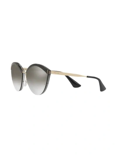 Shop Prada Oval Shaped Sunglasses In Schwarz